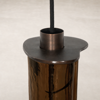 Chandelier with a sculptural design and reflective finish.