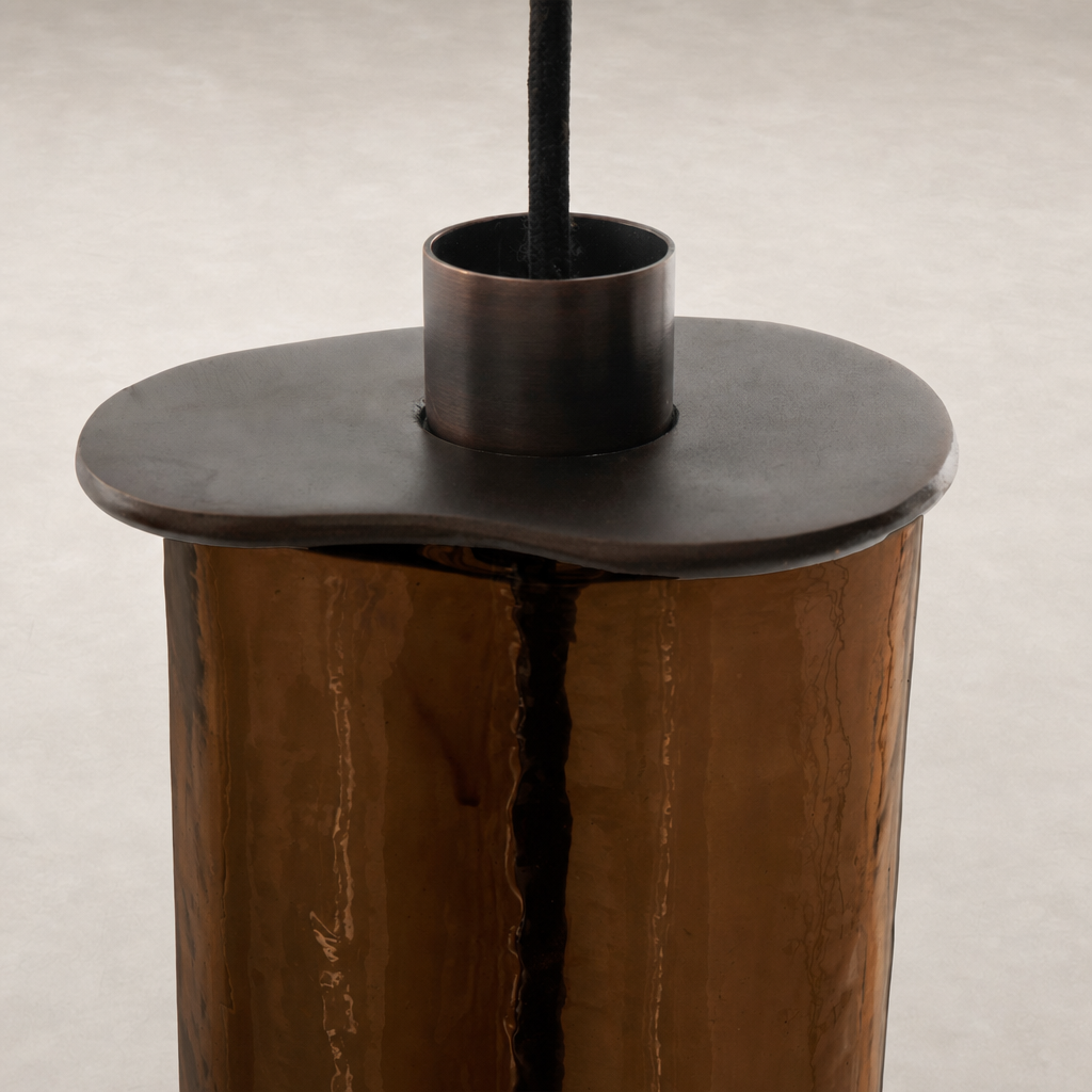 Chandelier with unique shaped top and reflective surface detail.