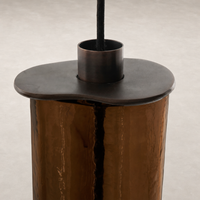 Chandelier with unique shaped top and reflective surface detail.
