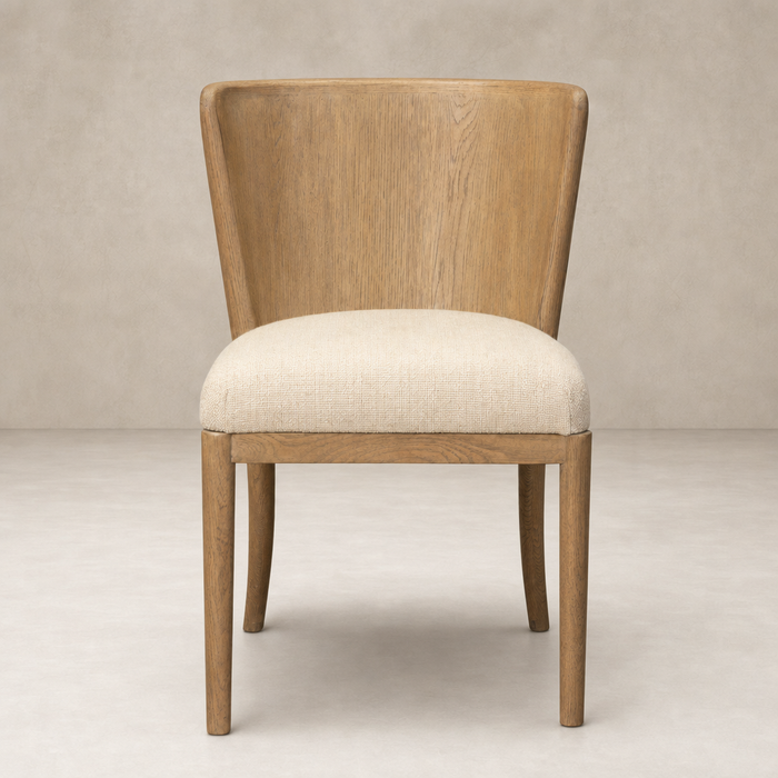Skye Dining Chair in Irving Flax features a curved wooden back and soft beige seat.