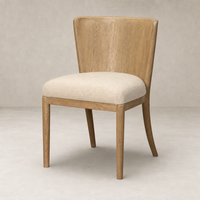 Skye Dining Chair in Irving Flax featuring a curved wood back and soft, textured seat.