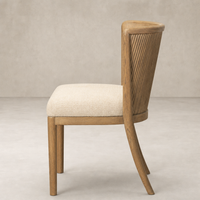 Skye Dining Chair in Irving Flax features a stylish textured seat and curved wooden back.