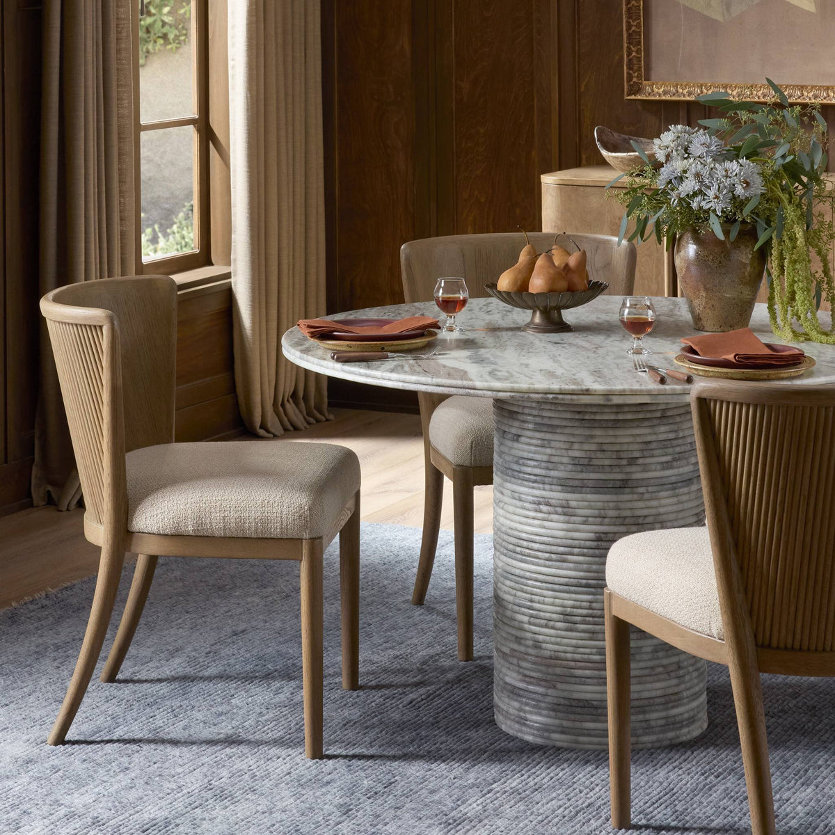 Skye Dining Chair in Irving Flax with soft upholstery and elegant curved backrest.