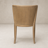 Skye Dining Chair in Irving Flax with ribbed wooden back and tapered legs.