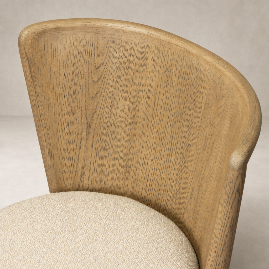 Skye Dining Chair in Irving Flax with a curved wooden back and soft textured seat.