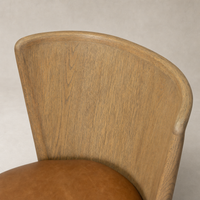 Skye Dining Chair in Sonoma Chestnut showcasing a curved wooden backrest and plush seat.