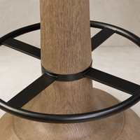 Counter stool with a natural wood finish and black metal accents.
