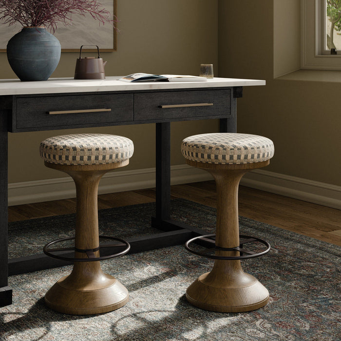 Firefinch Fawn counter stools with a round cushioned seat and sturdy wood base.