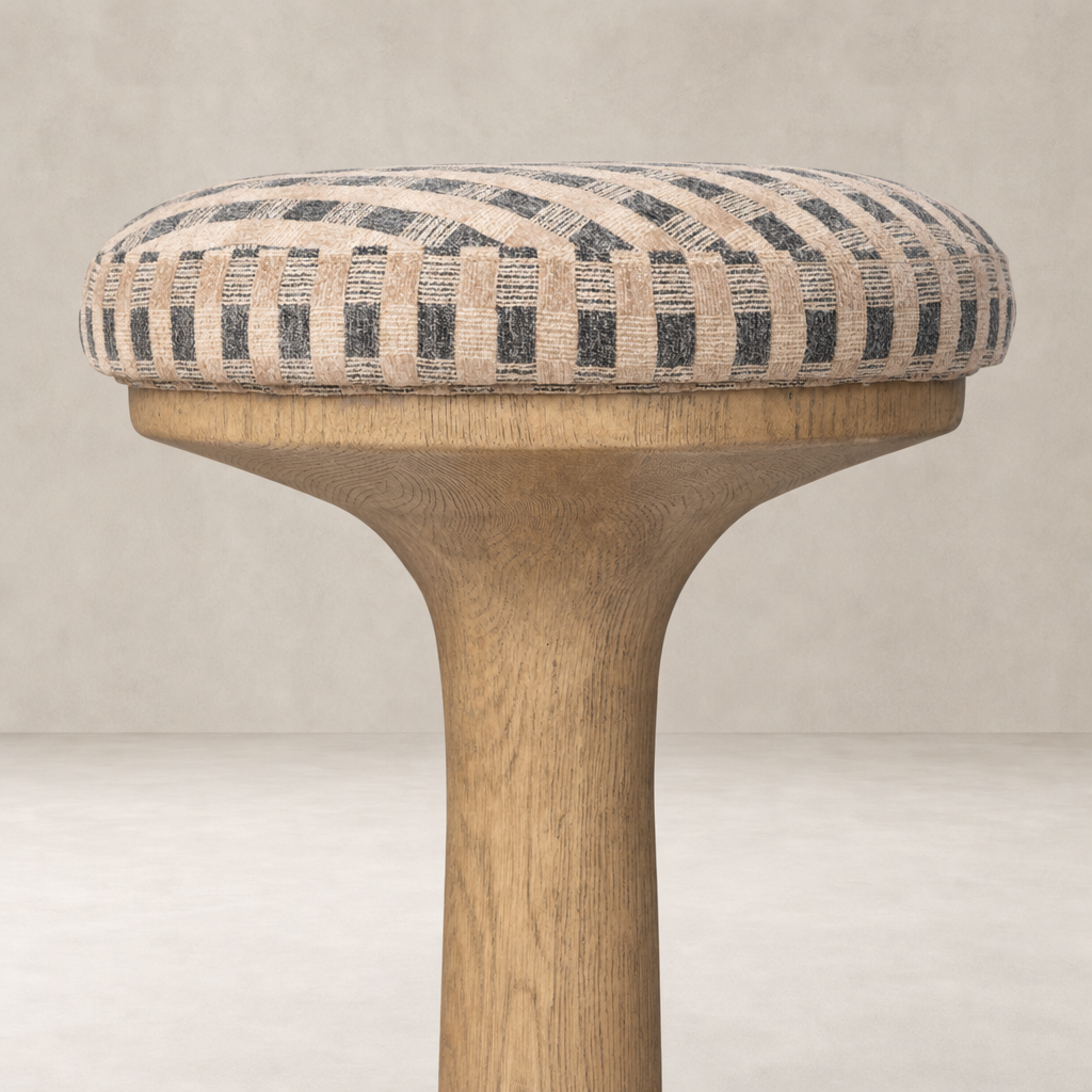 Counter stool with a patterned cushion and light wooden base in Firefinch Fawn.