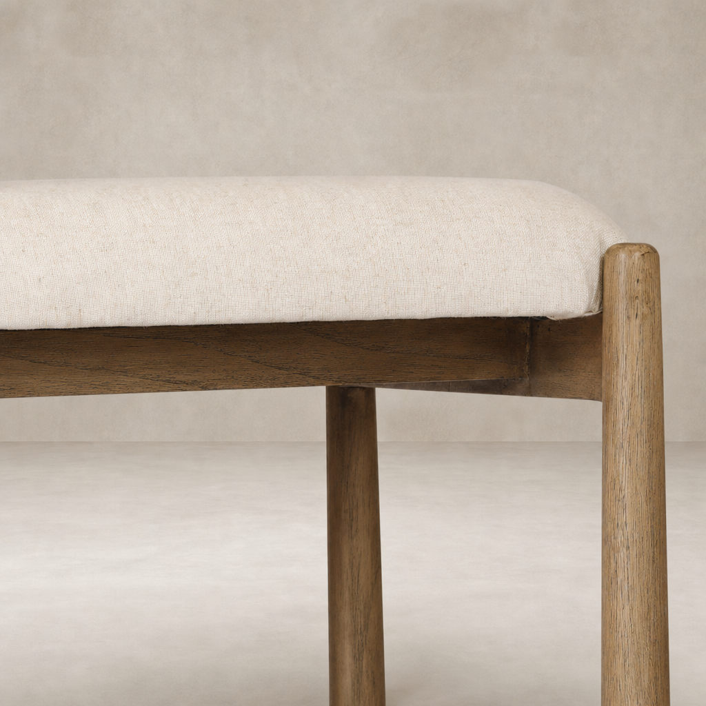 Seoul Bar + Counter Stool in Lynchart Sand with soft upholstery and natural wood legs.