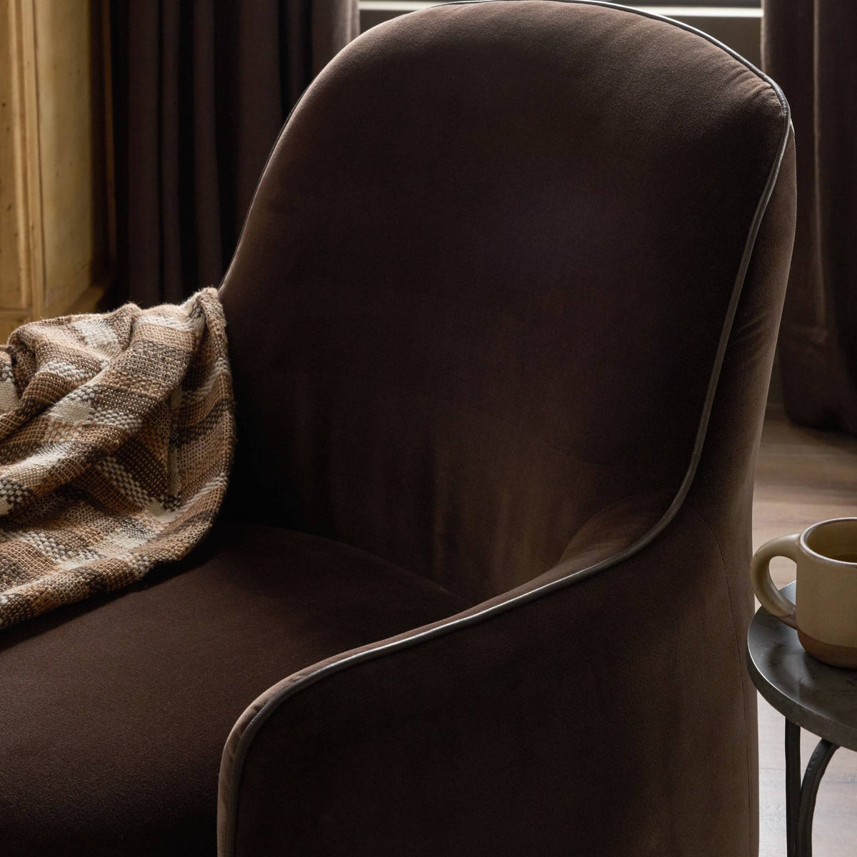 Paloma Swivel Chair in Surrey Cocoa featuring smooth, rounded edges and soft fabric.