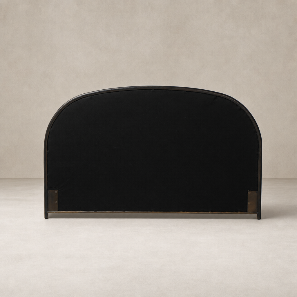 Savoy Parchment bed in a sleek, arched design with a minimalist finish.