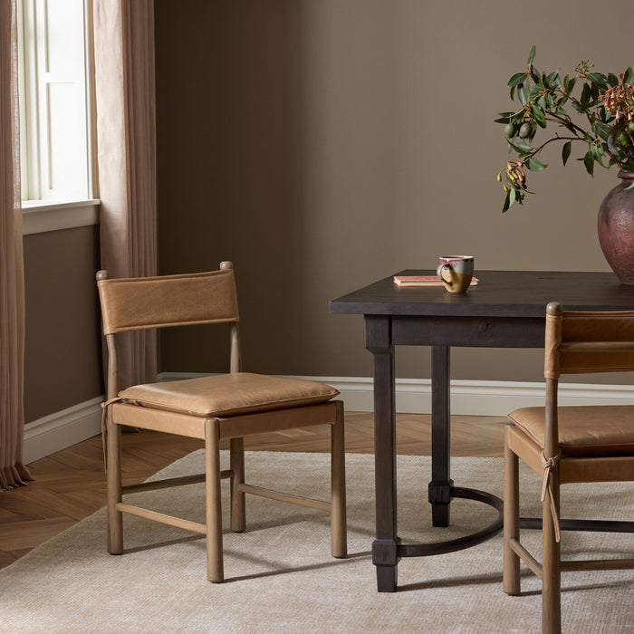 Winchester Beige dining chair with a sleek design and comfortable seat cushion.