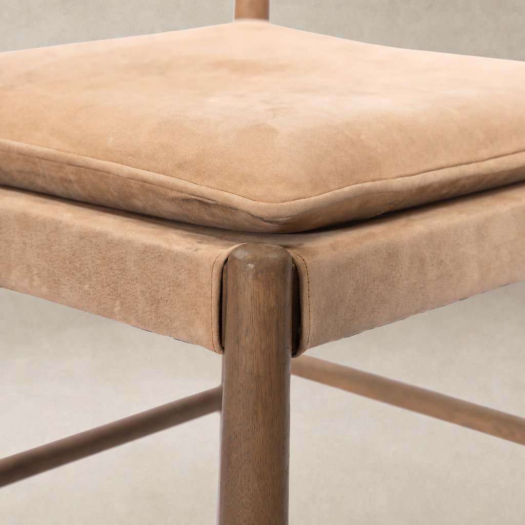 Winchester Beige dining chair with plush cushion and wood frame detail.