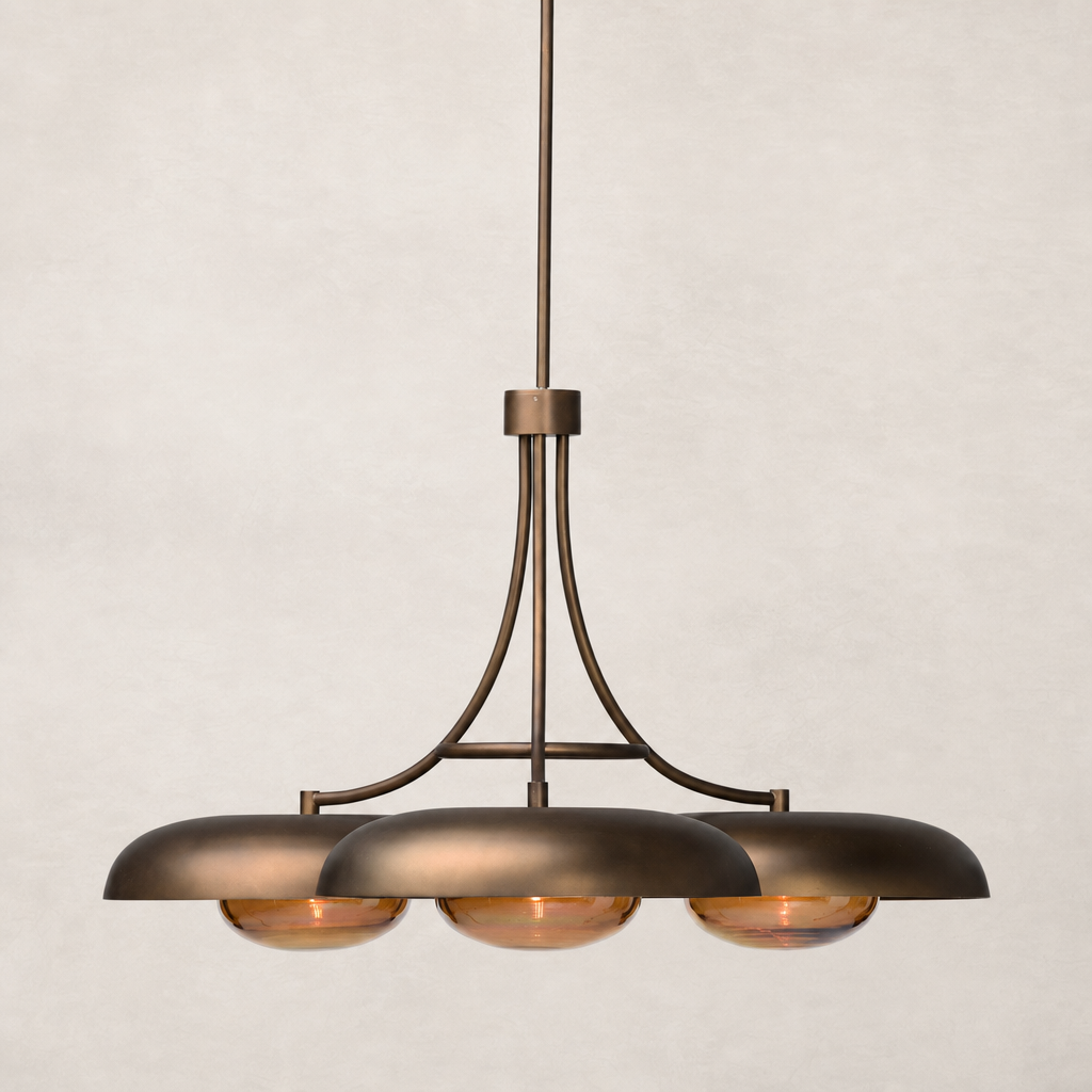 Oil rubbed bronze chandelier with three dome-shaped shades and elegant curves.
