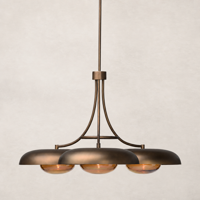 Oil rubbed bronze chandelier with three dome-shaped shades and elegant curves.