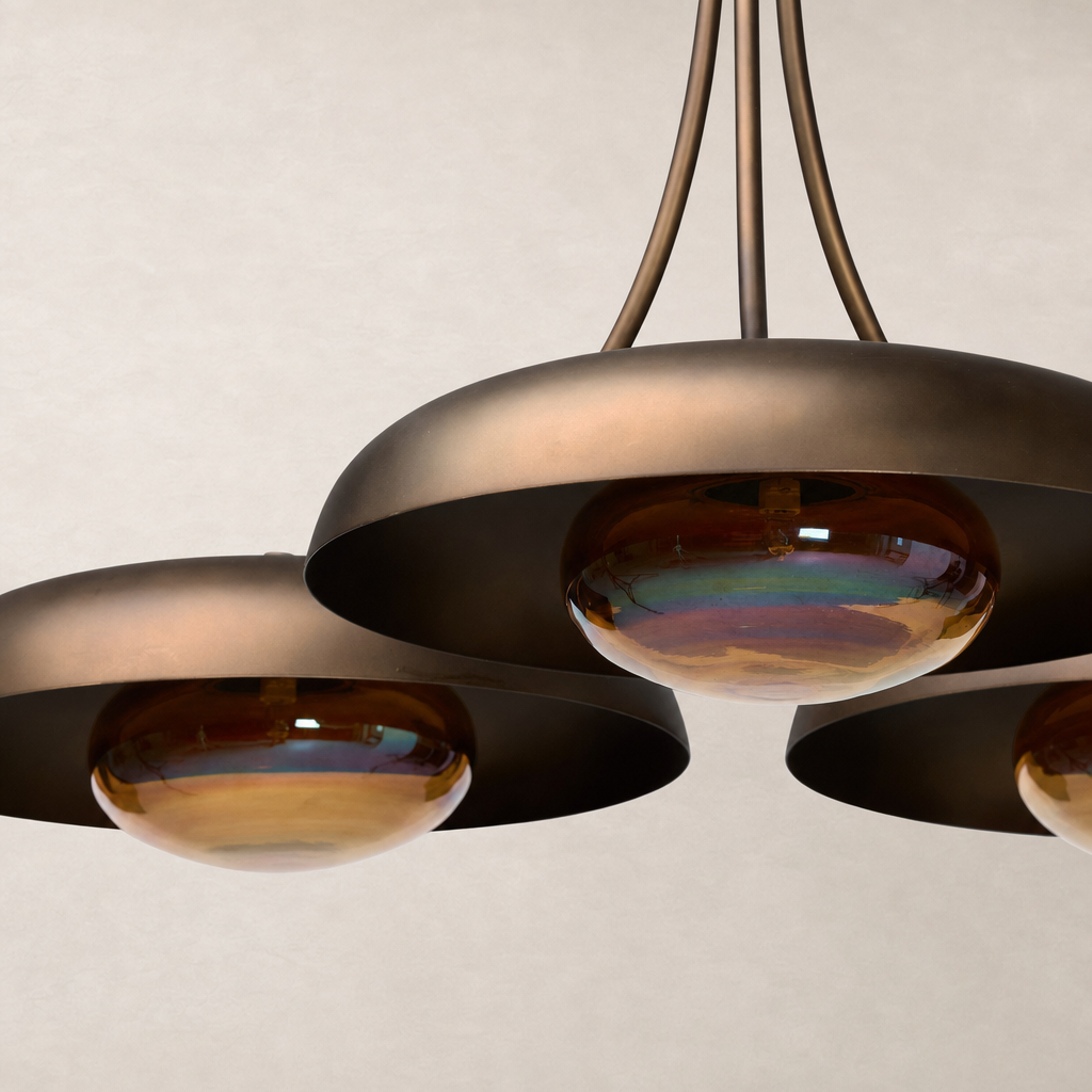 Oil rubbed bronze chandelier featuring elegant, curved shades and glass globes.