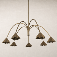 Aged antique brass iron chandelier with elegant fluted shades and sweeping arms.