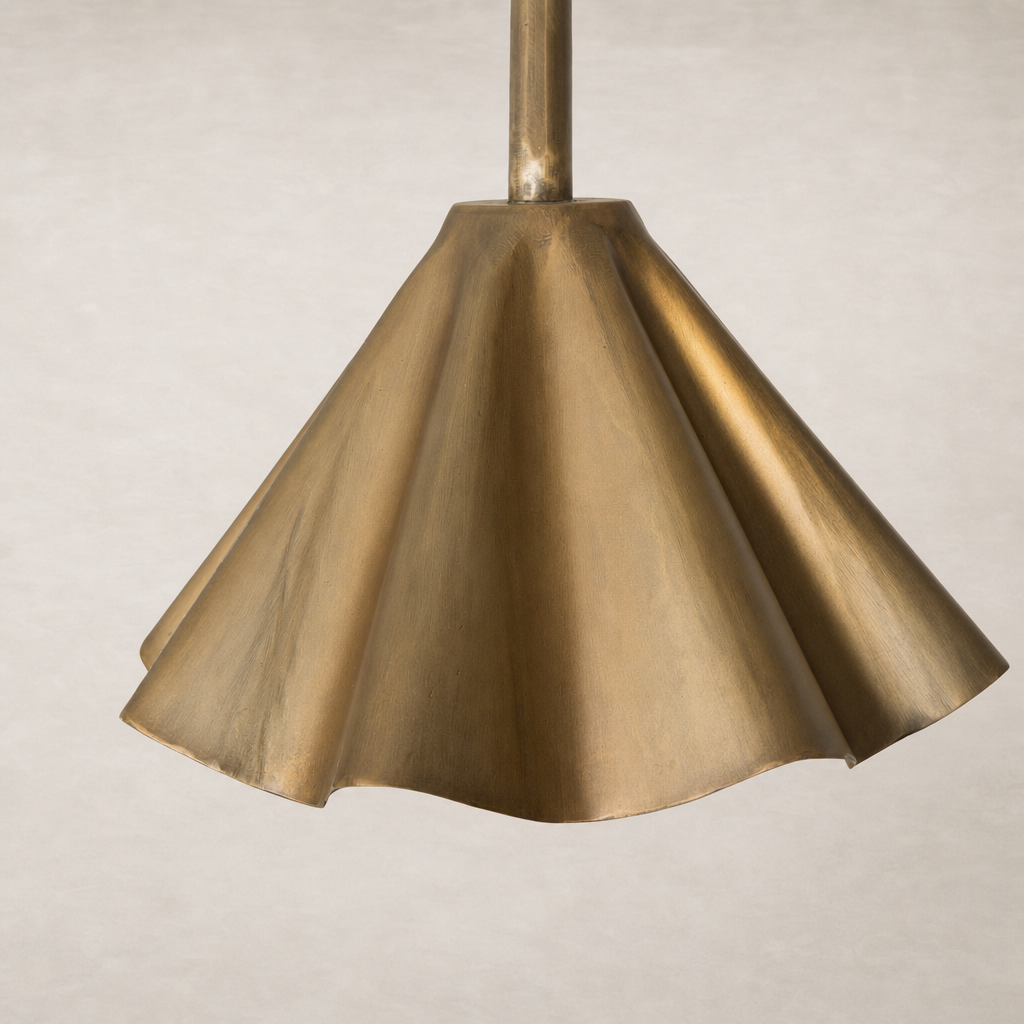 Aged antique brass iron chandelier with elegant fluted design and smooth finish.