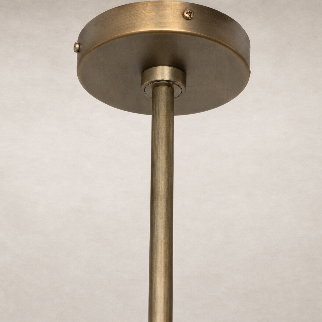 Aged antique brass iron chandelier featuring a sleek, modern design with a minimalistic finish.