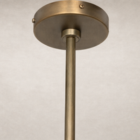 Aged antique brass iron chandelier featuring a sleek, modern design with a minimalistic finish.