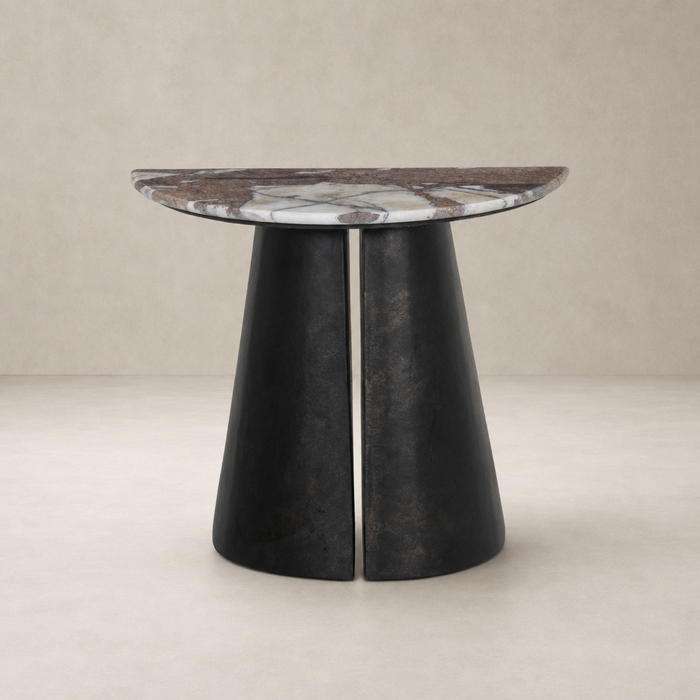 Bianca End Table features a round marble top and sleek black cone base.