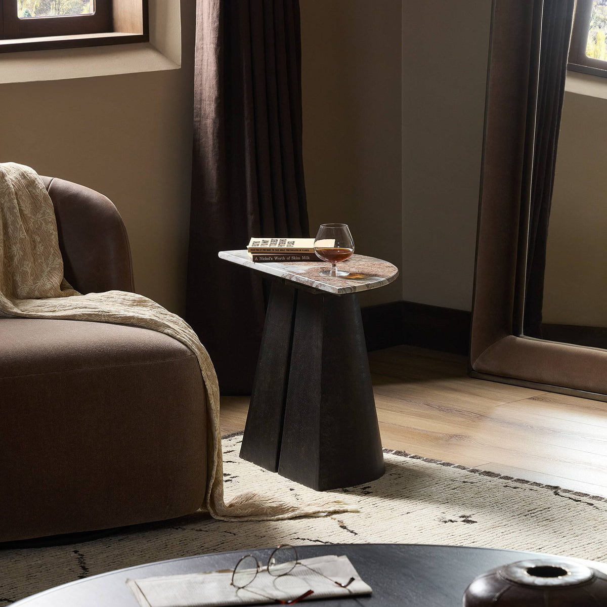 Bianca End Table with unique geometric base and stylish marble top, perfect for modern living spaces.