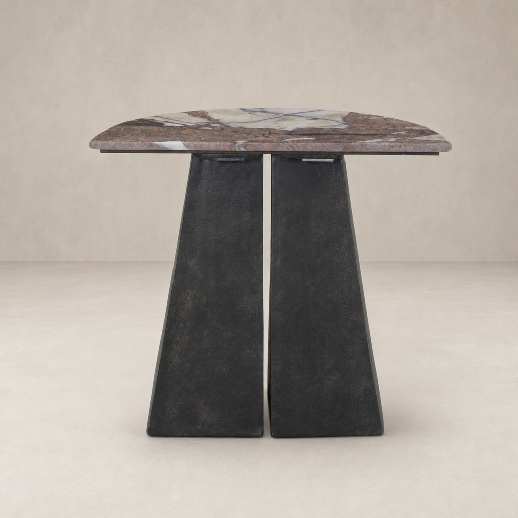 Bianca End Table features a sleek, rounded marble top and sturdy black base.