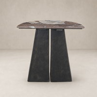 Bianca End Table features a sleek, rounded marble top and sturdy black base.