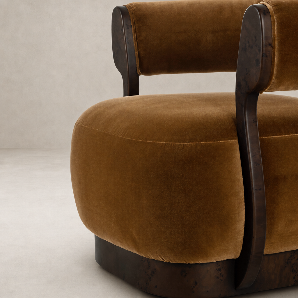Bodhi Swivel Chair in Surrey Ochre with plush velvet upholstery and wooden accents.