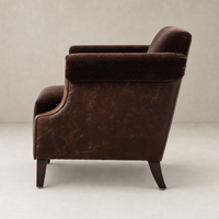 Serena Chair in Monte Chocolate featuring a plush fabric back and sleek leather base.