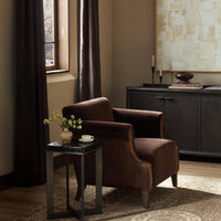 Serena Chair in Monte Chocolate, featuring sleek curved lines and rich upholstery.