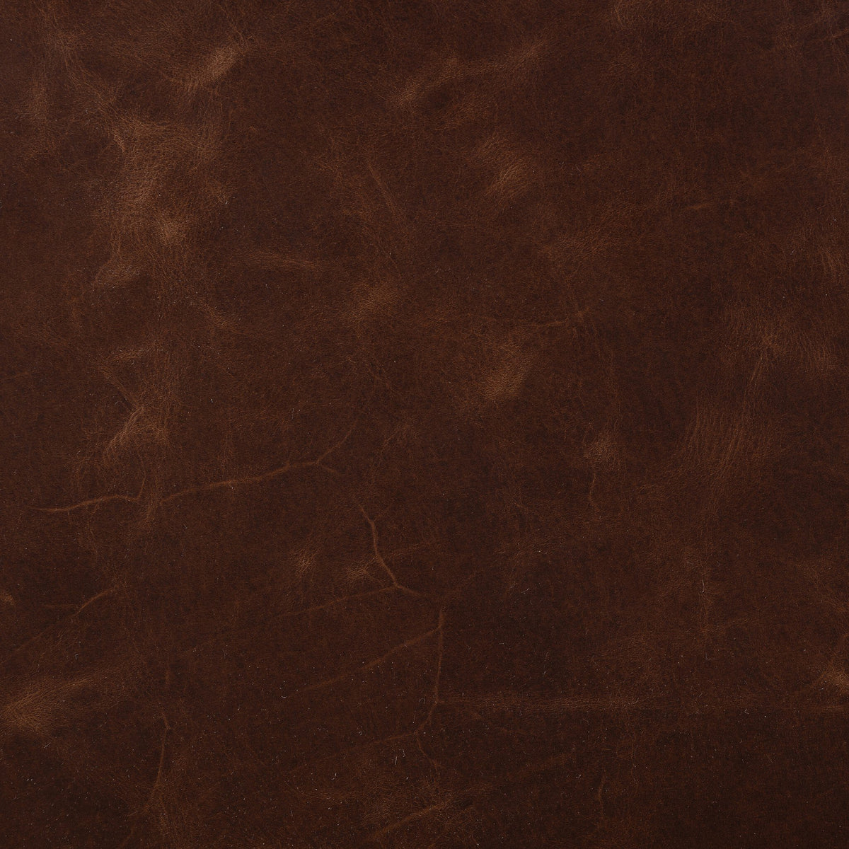 Rich Monte Chocolate leather texture showcasing the Serena Chair's premium material.