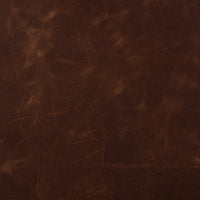 Rich Monte Chocolate leather texture showcasing the Serena Chair's premium material.