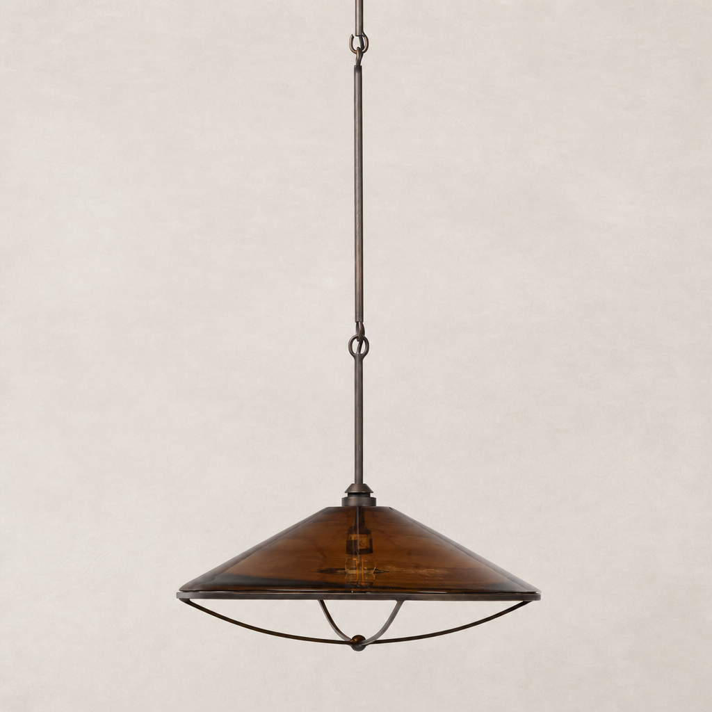 Amber glass pendant light with a sleek conical shape and metal detailing.