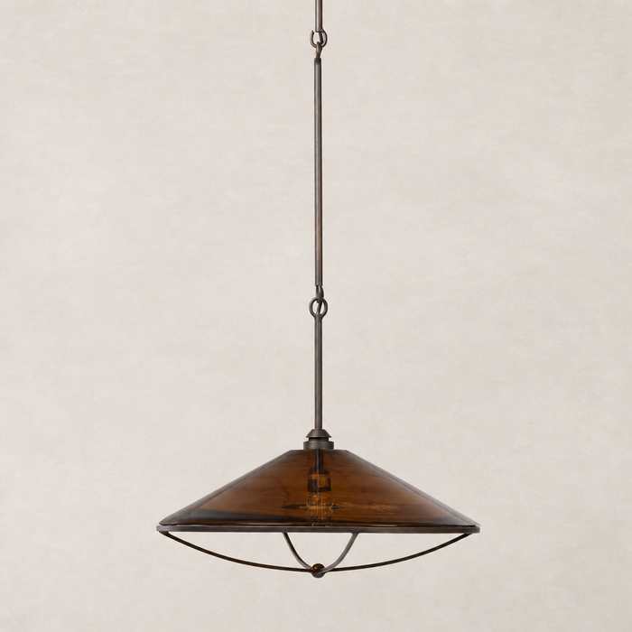 Amber glass pendant light with a sleek conical shape and metal detailing.