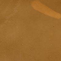 Amber glass pendant with a smooth, glossy finish reflecting light.