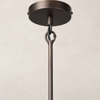 Amber glass pendant light with a sleek, modern design and matte bronze finish.