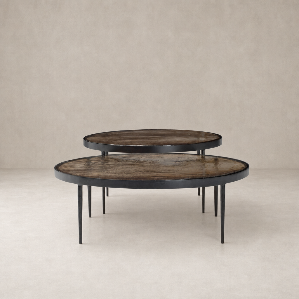 Kiko Nesting Tables in smoked brown cast glass with sleek round tops and slender legs.