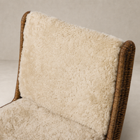 Ingrid Dining Chair in beige shorn shearling with a rounded, plush backrest.