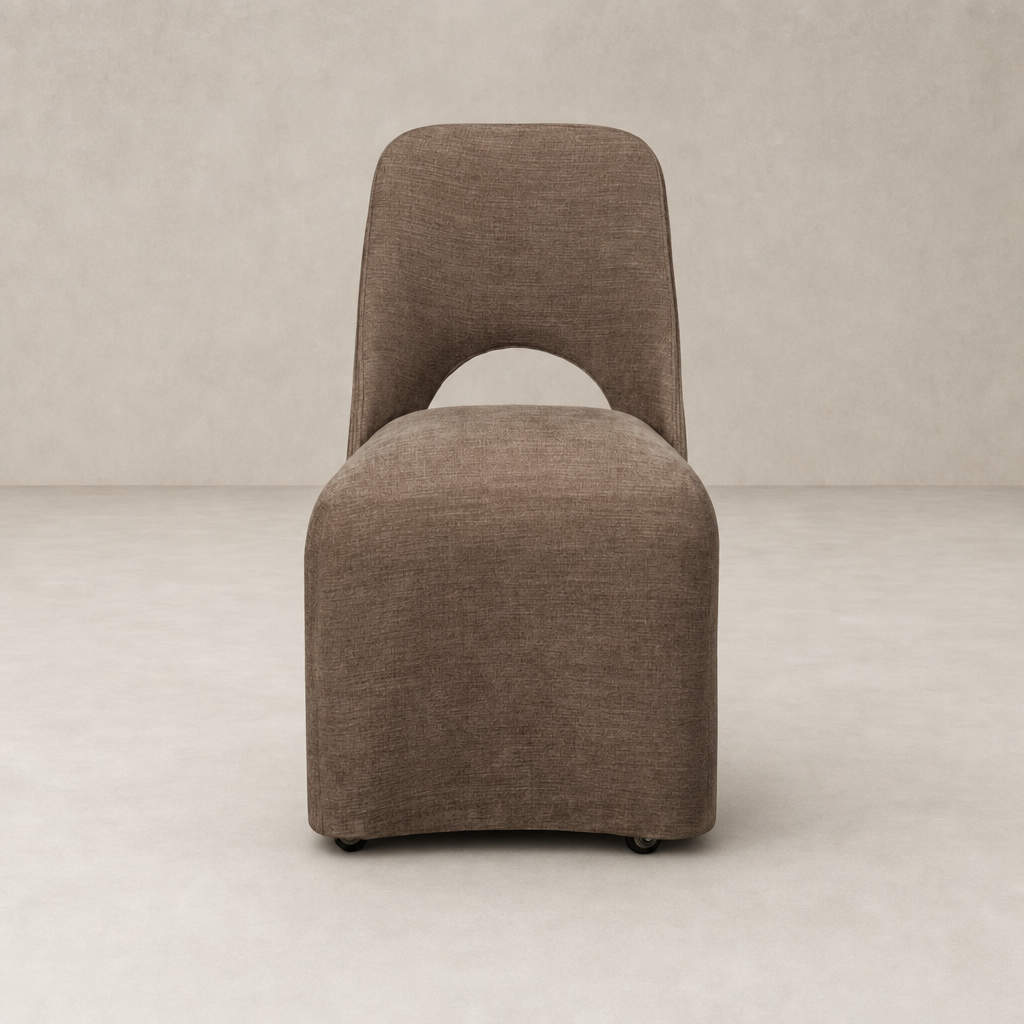 Huxley Dining Chair in Laughlin Cafe with curved back and sleek design.