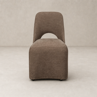 Huxley Dining Chair in Laughlin Cafe with curved back and sleek design.