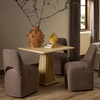 Huxley Dining Chair in Laughlin Cafe upholstered fabric, featuring a sleek, modern silhouette.