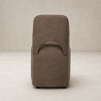 Huxley Dining Chair in Laughlin Cafe features a sleek design with a curved back.