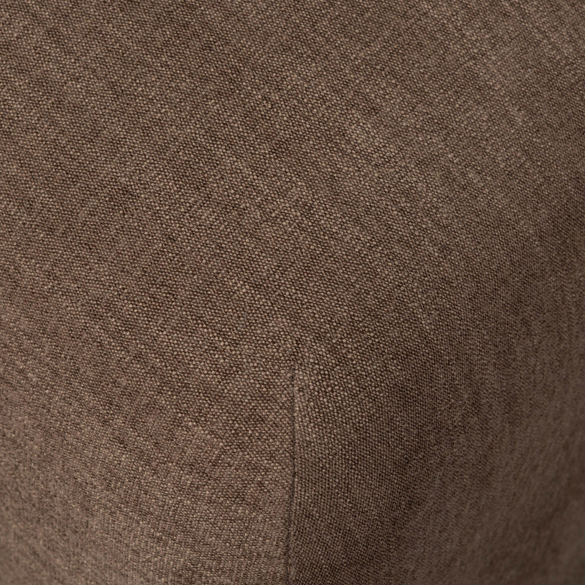Close-up of the textured Laughlin Cafe fabric on the Huxley Dining Chair.