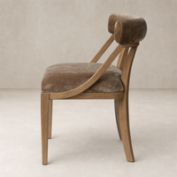 Elegant Altair Mushroom dining chair with curved backrest and wooden legs.