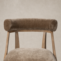Altair Mushroom dining chair featuring a rounded velvet backrest and wooden frame.