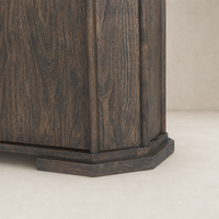 Dark brown acacia Paolo sideboard showcasing sleek octagonal base and wood grain texture.