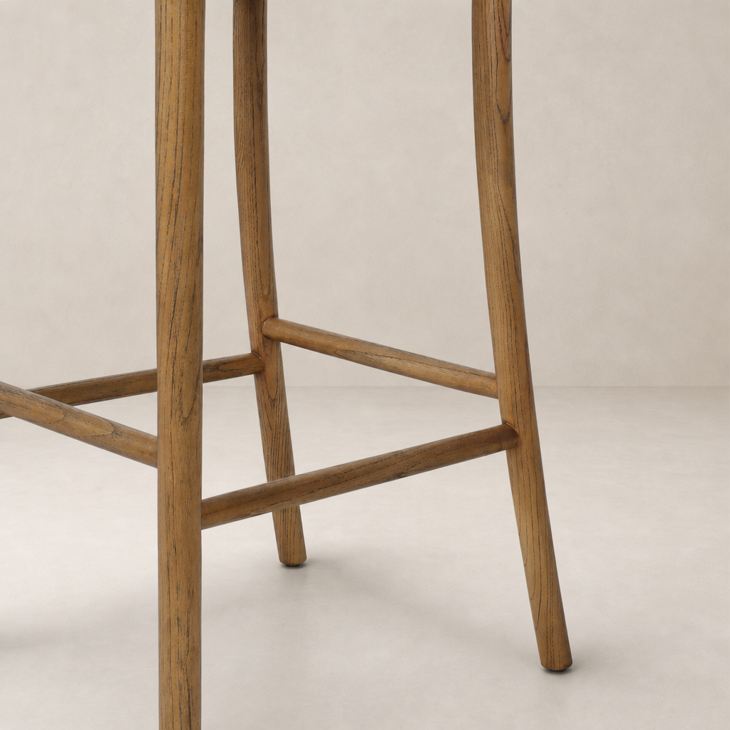 Berlin Bar + Counter Stool in Haven Tobacco with sturdy wooden legs and crossbeam.