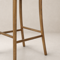 Berlin Bar + Counter Stool in Haven Tobacco with sturdy wooden legs and crossbeam.